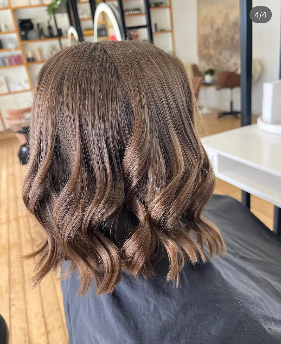 Soft brunette waves styled at Esencia Hair Studio