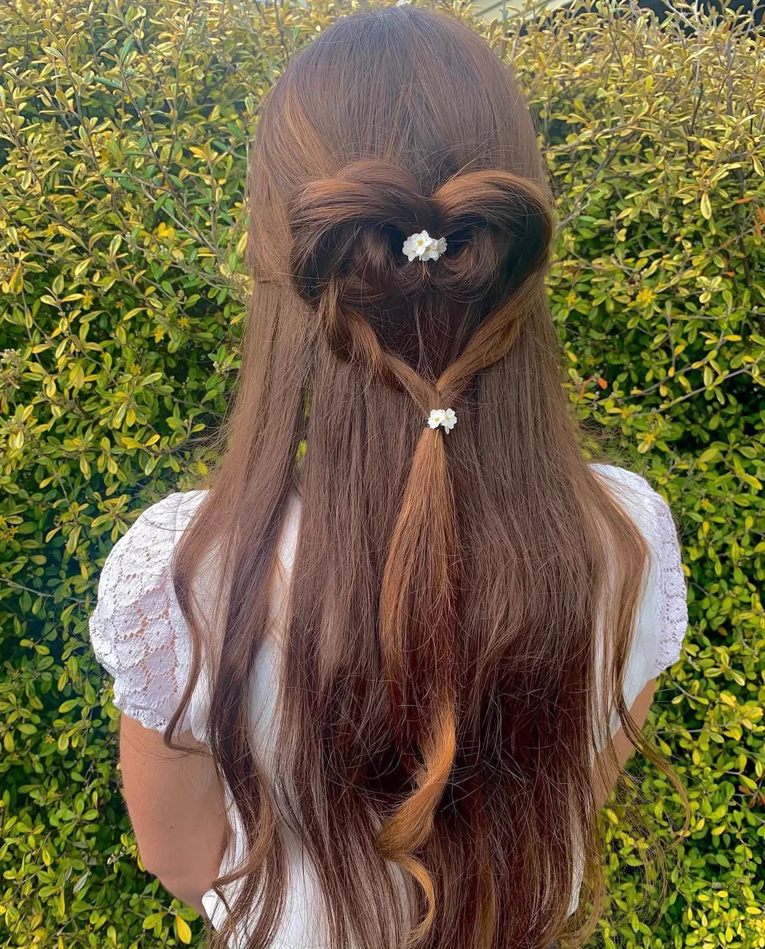 Soft half-up hairstyle with a floral clip